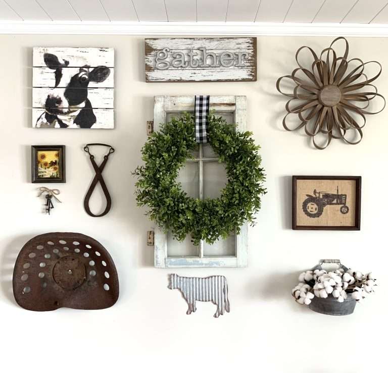 farmhouse gallery wall with window with wreath, tractor seat, cow picture, gather sign, bucket of cotton